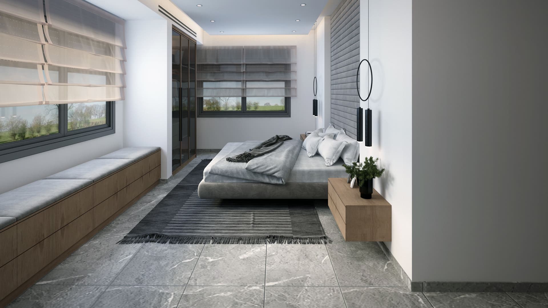A large bedroom with a window seat in winter light