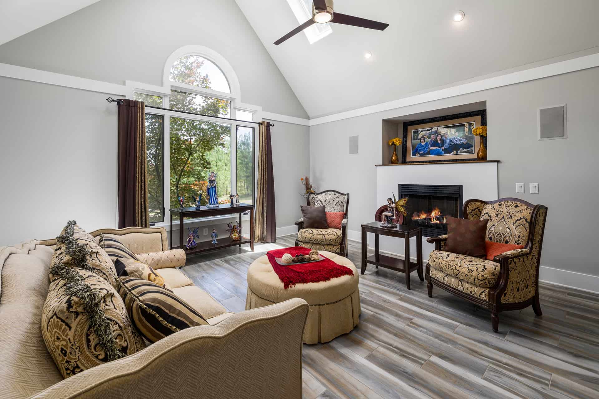 A room with a high vaulted ceiling and tall windows