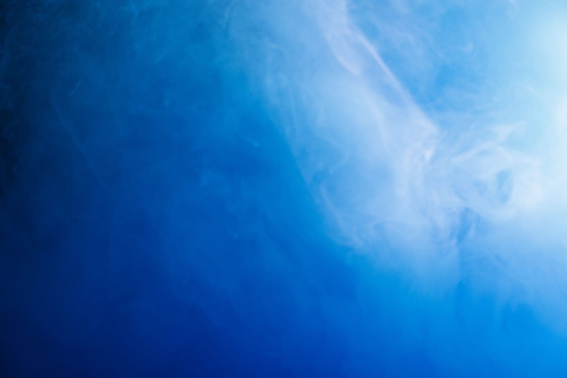 Soft vapor swirling against a plain background