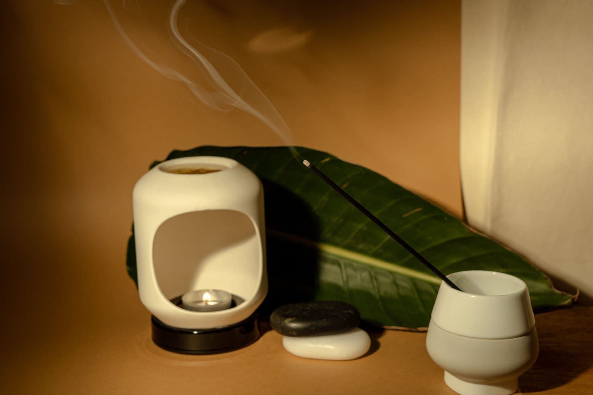 A small ceramic diffuser on a bedside table