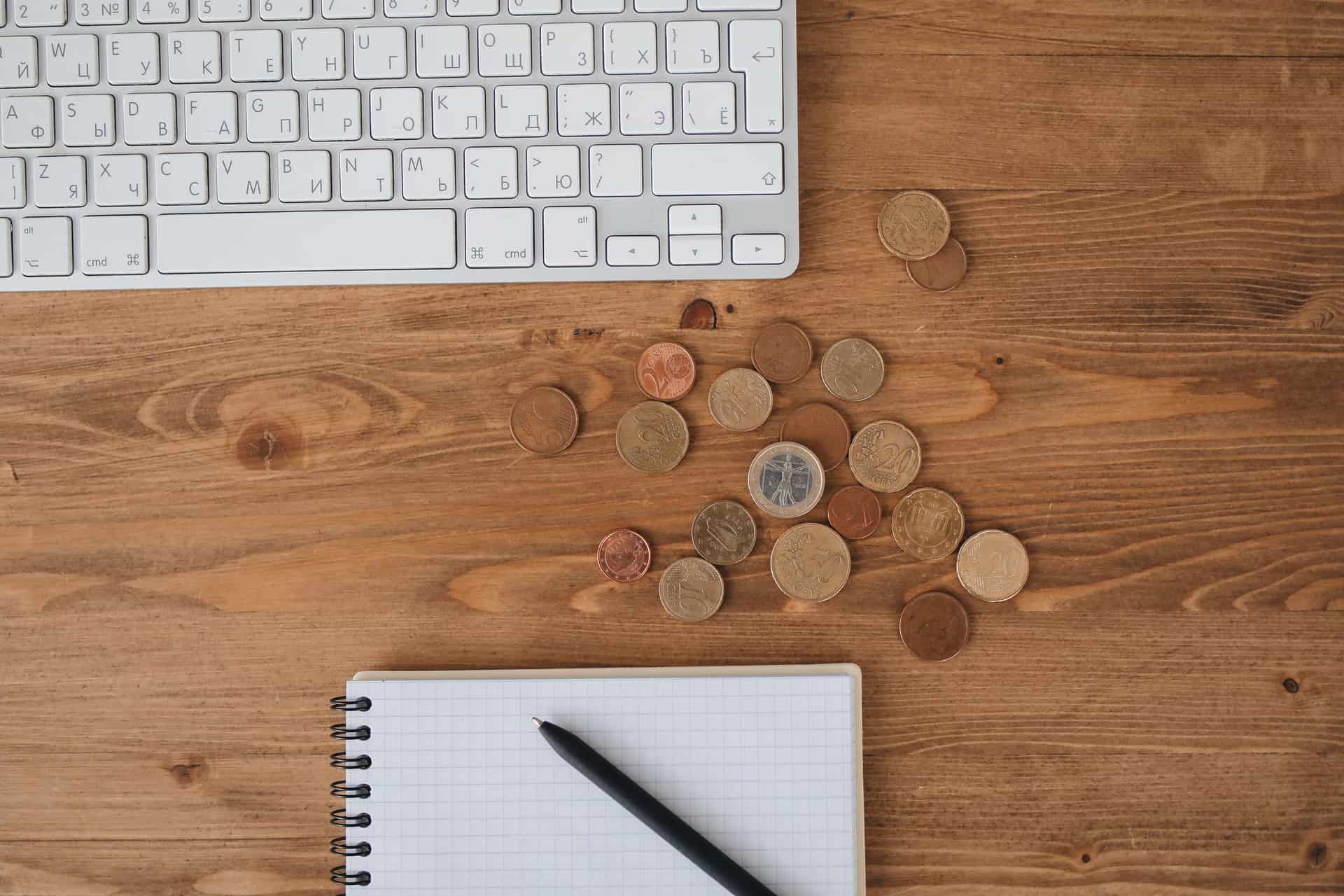 A ledger notebook and pen on a desk