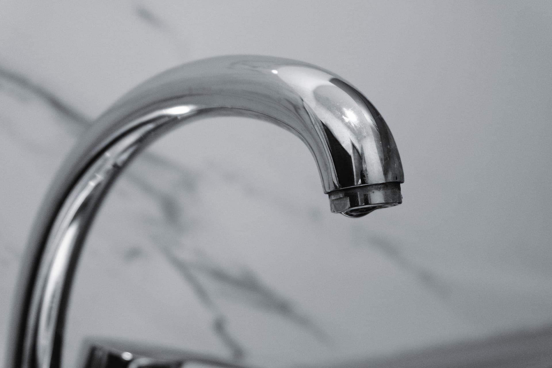 Limescale on a chrome tap in a bathroom