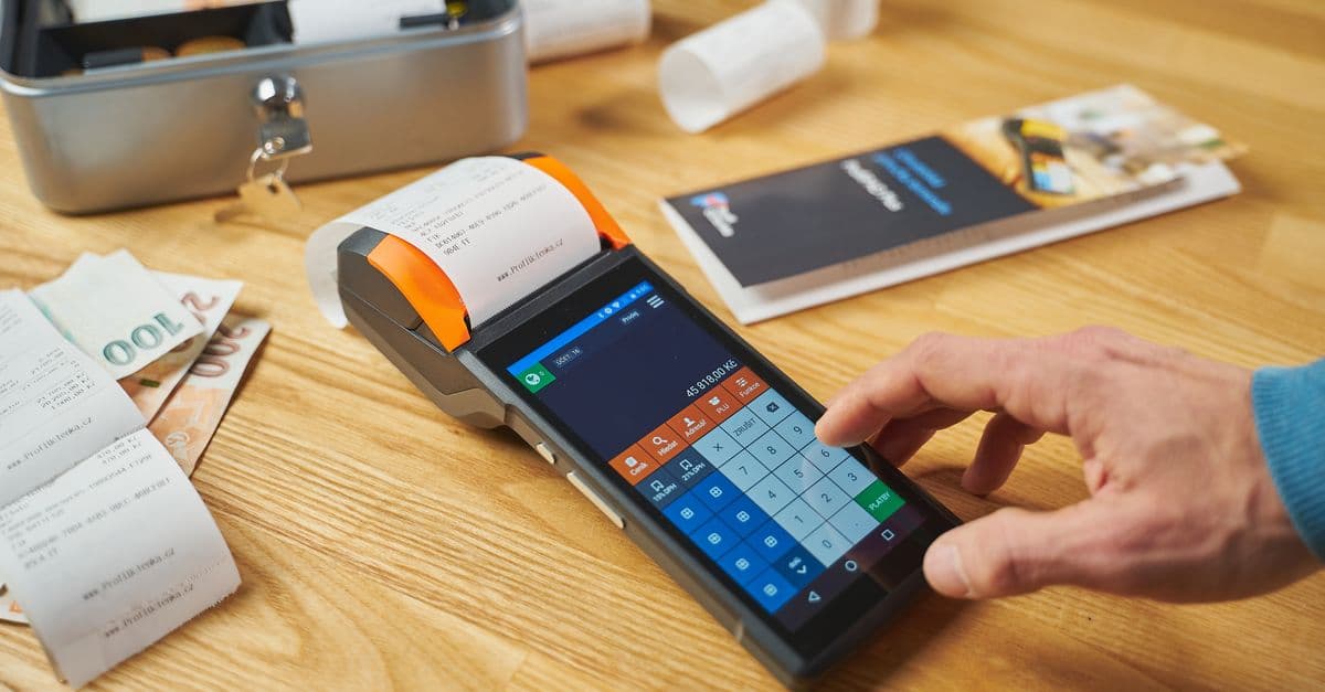 A card terminal and printed receipts on a desk