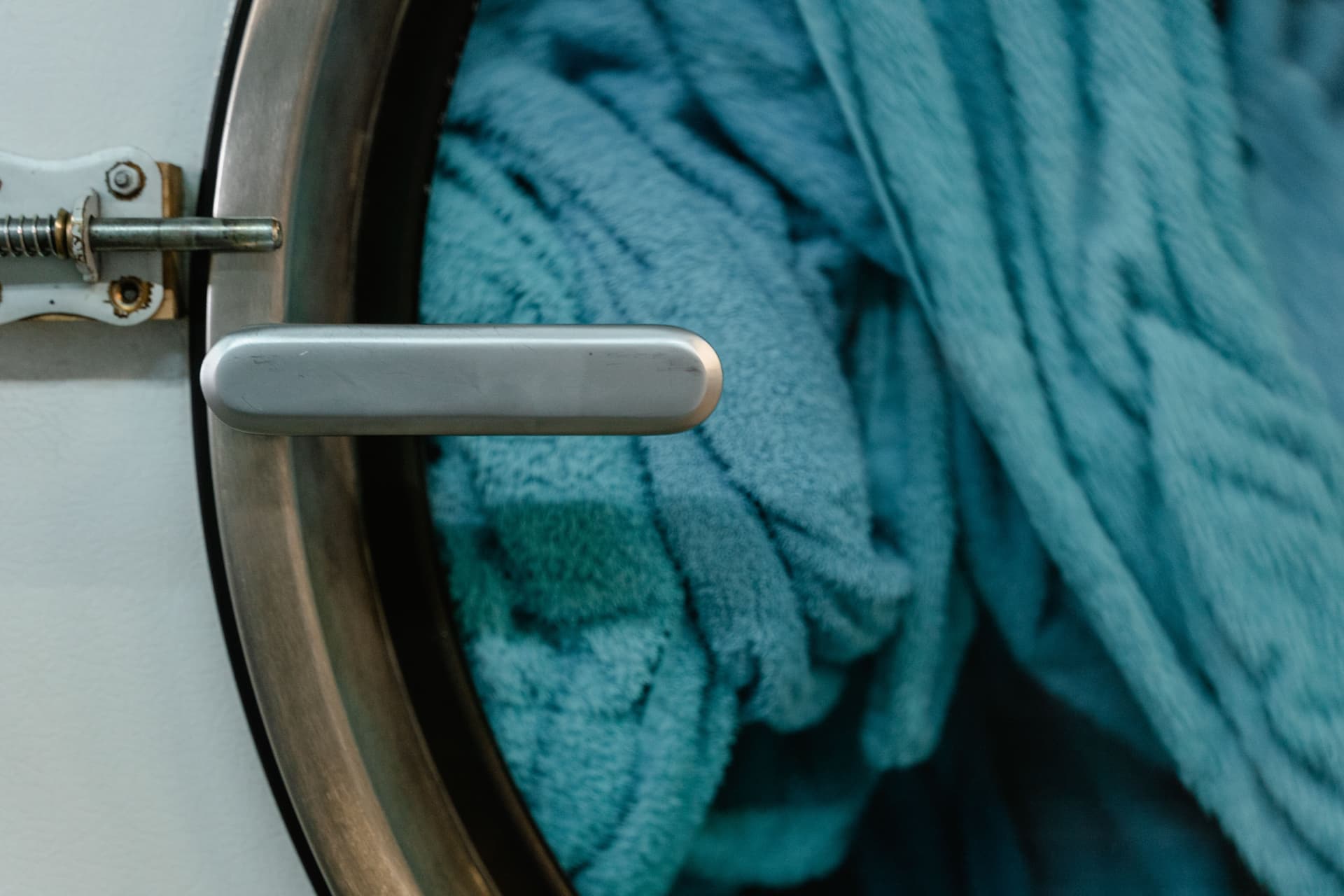 A clean empty water tank drying on a towel