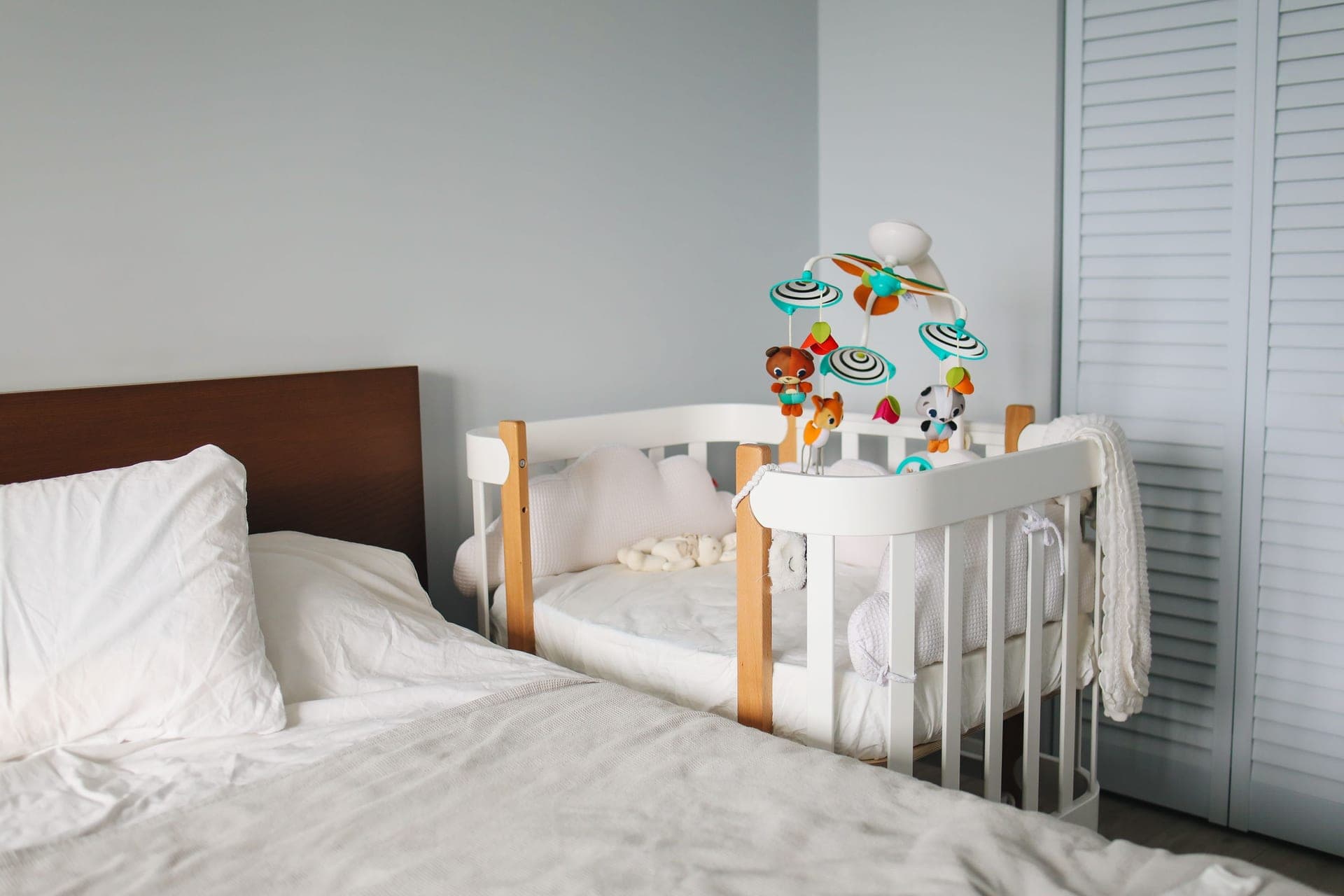 A quiet nursery room with a crib in soft daylight
