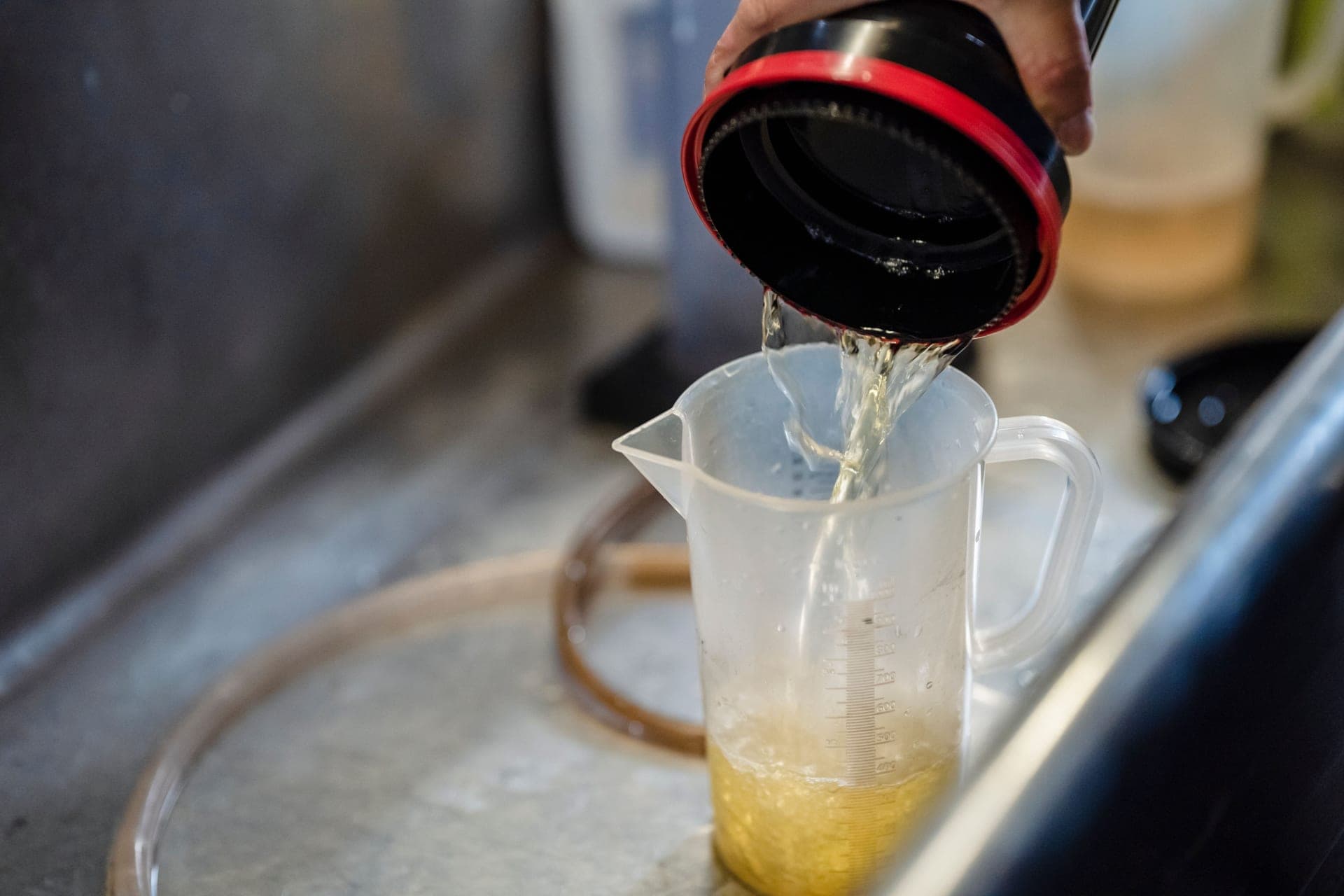 Water being poured from a jug into a container